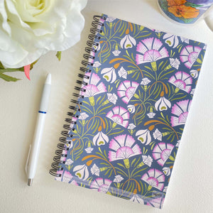 Carnation & Snowdrop Soft Cover Notebook is 5.5 x 8.5 inches and 80 College Ruled Pages.